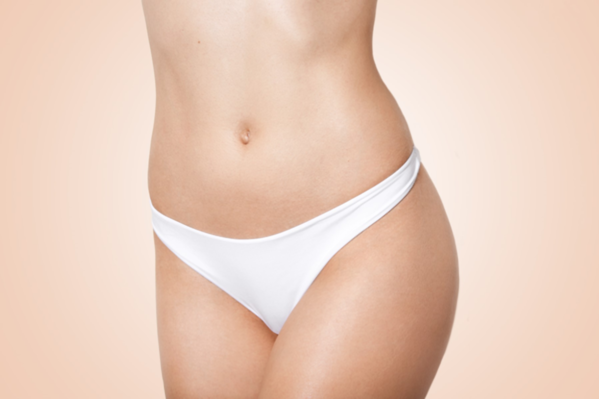 Coco Ruby Plastic Surgery- Liposuction or a Tummy Tuck for a Flatter Stomach Blog - Woman with Flat Tummy